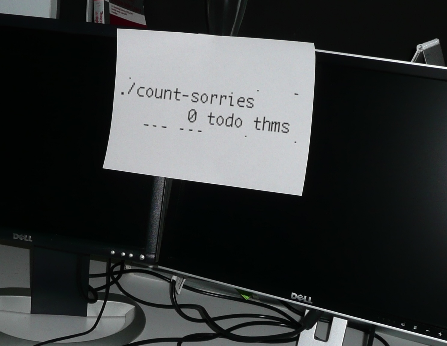 picture of a piece of paper with 0 sorries printed on it, tapped to a computer monitor